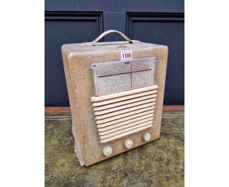 A vintage HMV portable combined radio and record player, model No.1507. 
