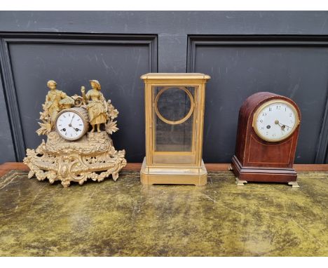 A late Victorian gilt spelter mantel clock; together with a late Victorian mahogany and chequer strung dome top mantel clock;