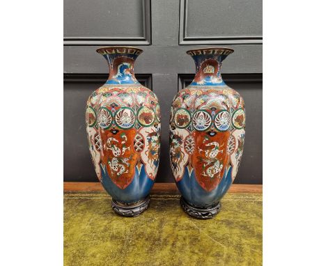 A large pair of Japanese cloisonne enamel vases,&nbsp;on fixed wood bases, 48.5cm high, (s.d.). 
