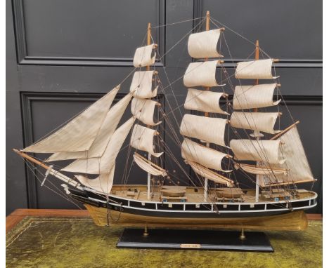 A painted wood model of The Cutty Sark, total length 88cm. 