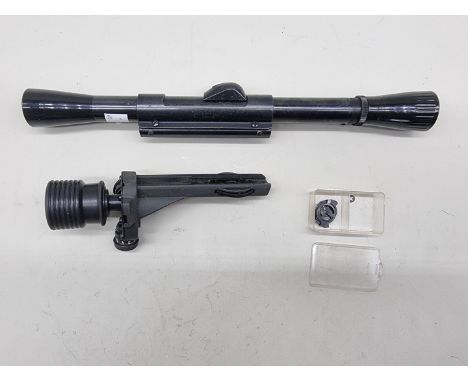 A Weaver model C4 rifle scope, with tip off mount; together with a Diopter rear sight. (2) 