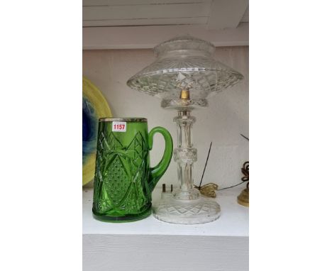 A cut glass table lamp,&nbsp;43cm high; together with a cut green glass jug, 22.5cm high. (2) 