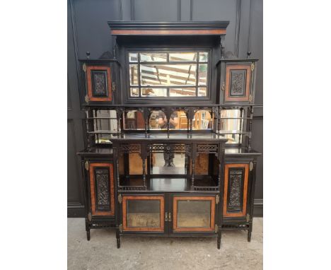 A large and impressive Aesthetic ebonized and amboyna mirror back side cabinet, 168.5cm wide. 