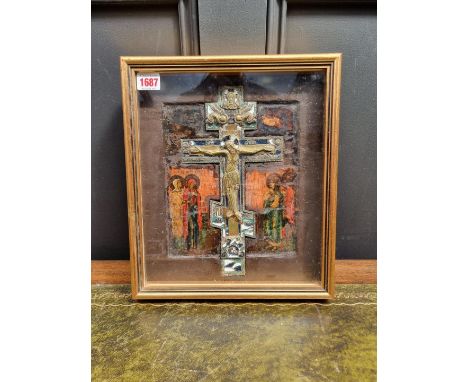 An antique Russian brass, champleve enamel and polychrome painted icon,&nbsp;framed and glazed, the whole 33.5 x 29cm. 