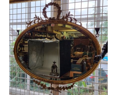 A Victorian gilt framed oval wall mirror, 75.5 x 77.5cm.&nbsp; 