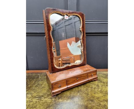 A George III mahogany toilet mirror,&nbsp;43cm wide.&nbsp; 