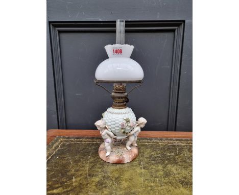 A Sitzendorf porcelain oil lamp,&nbsp;height including chimney 38cm, (shade possibly associated). 