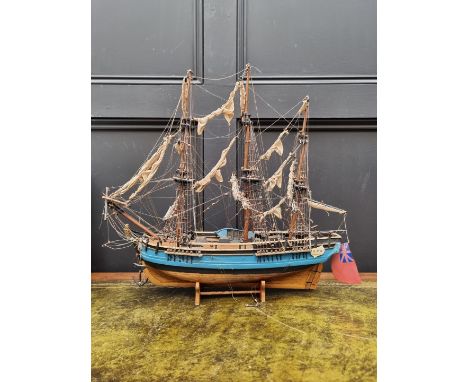 A painted wood model of 'The Bounty', 50cm long, on wood stand.&nbsp; 