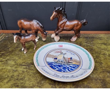 A Poole pottery commemorative&nbsp;plate, 27.5cm diameter; together with three Beswick horses. (4) 
