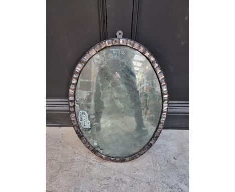 An Irish style oval wall mirror,&nbsp;59 x 44.5cm.&nbsp; 