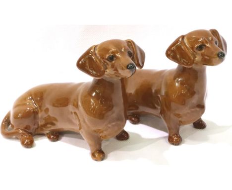 Two Beswick dachshunds, each L: 13 cm. No cracks, chips or visible restoration. P&amp;P Group 1 (£14+VAT for the first lot an