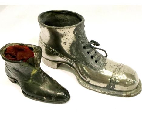 Two vintage white metal cast shoe pin cushions, largest lacking cushion, largest L: 10 cm.  P&amp;P Group 1 (£14+VAT for the 