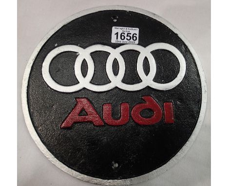 Cast iron circular Audi plaque, D: 18 cm. P&amp;P Group 2 (£18+VAT for the first lot and £3+VAT for subsequent lots) 