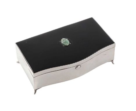 An art deco silver jewellery box with four small feet and a serpentine front with a button thumb press, the cover enamelled i