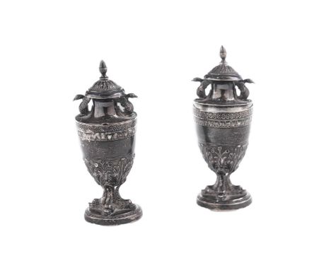 A pair of late 18th century Italian silver condiments of neo classical form, with dolphin supports and bird handles on the co