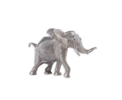 An Elizabeth II cast silver miniature figure of an elephant in a charging pose with ears facing forwards, and head, trunk and