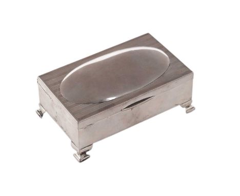 A George VI silver jewellery box, rectangular on four bracket feet, the cover with a plain central dome bordered by engine tu