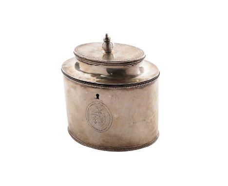 A George III silver tea caddy, oval with bead borders and a flattened, domed cover with a later finial, engraved on the front