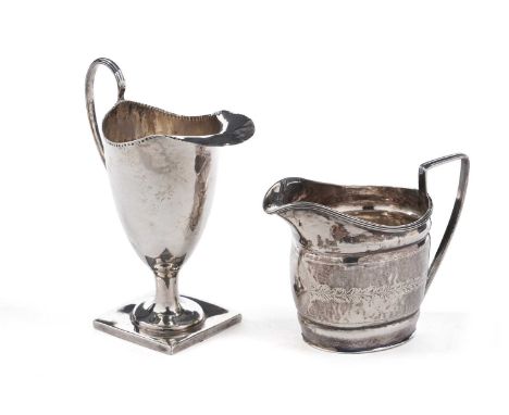 A George III silver cream jug, oval with light engraving, a flat base and reeded borders, by Thomas Law, Sheffield 1803; and 