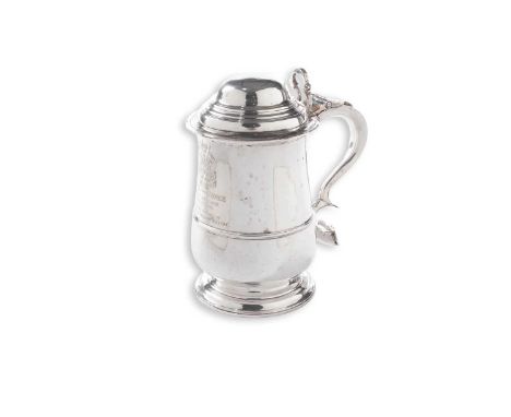 Regimental interest: a late Victorian silver tankard in the style of a George III example with a baluster body, large scroll 