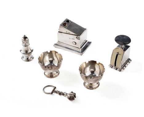 A late Victorian silver cigar cutter, with a bevelled rectangular base, a push-down action, and two apertures, by W. Gibson a