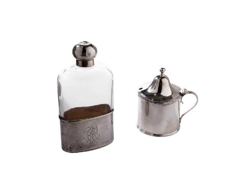 A Victorian silver mounted glass spirit flask, monogrammed, by Norman Marshall, London 1891; and a silver mustard pot, with a