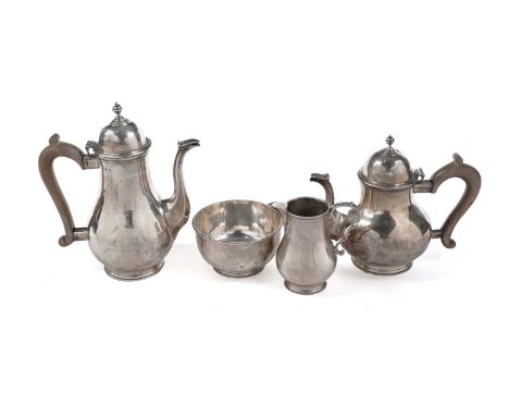 A George V silver four-piece tea and coffee service, with plain baluster bodies and scroll handles, the teapot and coffee pot