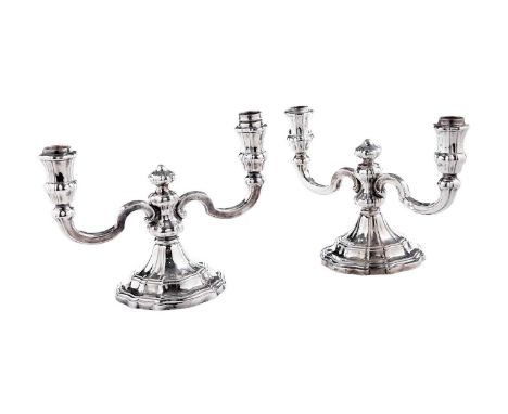 A pair of early 20th Century German silver, twin-light dwarf candelabra, on rising, shaped circular bases, by Jakob Grimminge