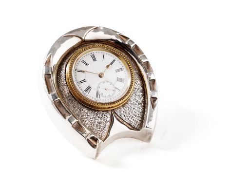 A late Victorian silver mounted timepiece, in the form of a horseshoe with an easel stand, the white enamelled dial with Roma