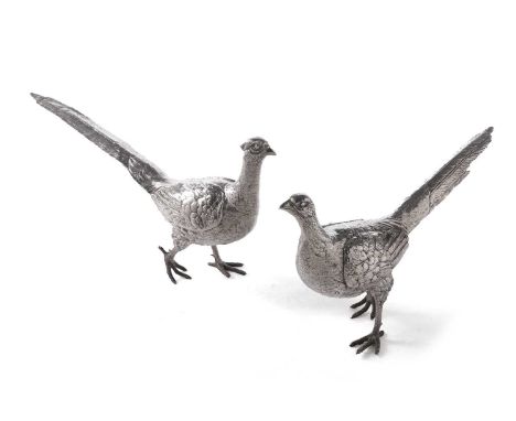 A pair of large continental silver table decorations in the form of a brace of pheasants, realistically modelled each in a wa