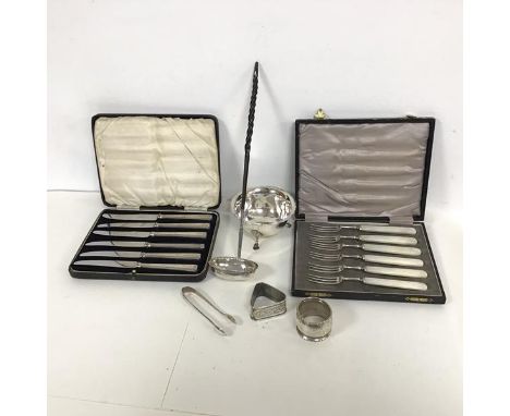A mixed lot comprising a silver footed sugar bowl and tongs, two silver napkin rings, one of triangular form, a whalebone sil