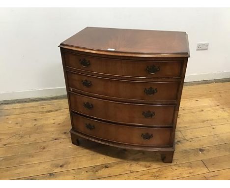 A Regency style bow front chest, c. mid 20thc., the rectangular top with moulded edge above four long drawers, raised on brac