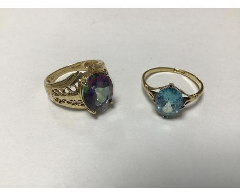 A 9ct gold dress ring set plate blue stone (Q/L) and a 9ct gold QVC dress ring mounted oval multi coloured gems (O/N) (7.4g) 