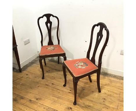 A pair of early 20thc mahogany side chairs, each with arched back and pierced splat, above a tapestry seat, on cabriole legs 