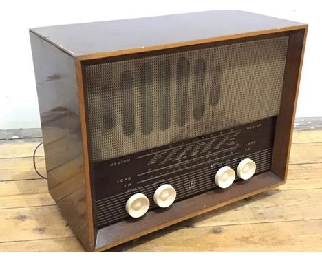 A Ferranti walnut cased mid century radio, with medium, long and FM, with four cream plastic nobs, in rectangular boxed case,