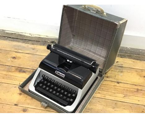 A Vintage child's Lilliput portable typewriter complete with original case, complete with key