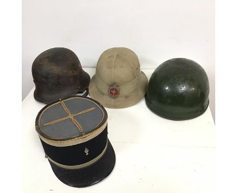 A 1942 Failsworth Hats Ltd., pith helmet, size 6 1/8 (h.16cm), a 1940s helmet inscribed Sergeant Marshall to interior lining,