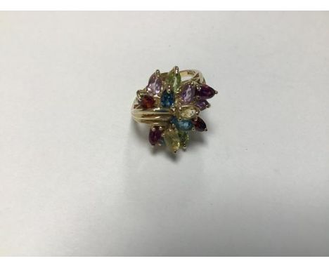 A 9ct gold ring set semi precious stones, including amethysts, garnets, spinnels, zircons etc. (M/N) (5.3g)