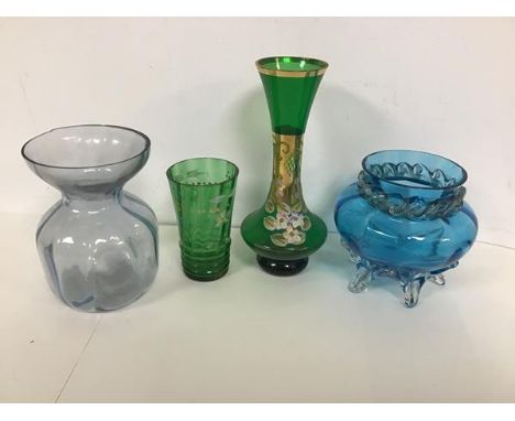 A mixed lot of glassware including a blue glass vase with a faceted edge over a wave motif neck with an urn shaped body on fi