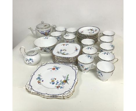 A Tuscan china teaset comprising twelve cups and saucers, eleven tea plates, two sandwich plates, a bowl and creamer, all in 