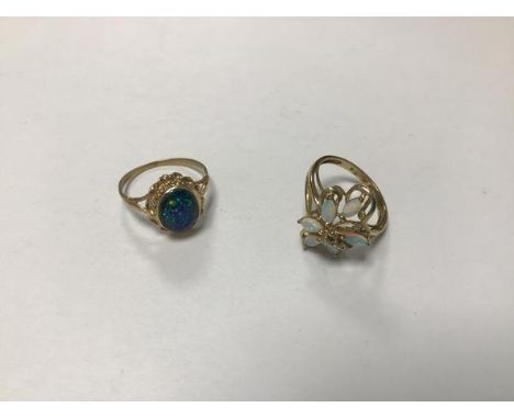 A 9ct gold water opal and diamond cluster ring (missing one opal) (T/N) and a 9ct gold opal doublet ring mounted in rope patt