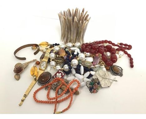 A collection of costume jewellery including a lady's Tissot watch on a gilt metal bracelet, a pink coral bead necklace, a dar