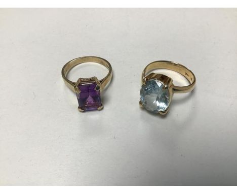 A 9ct gold ring set cushion cut amethyst mounted in claw setting (l/Q) and a 9ct gold ring mounted blue stone in claw setting