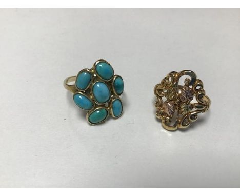 A 9ct gold turquoise set cluster ring (P/O), a 9ct three coloured gold openwork leaf and scroll ring (M) (5.8g) (2)