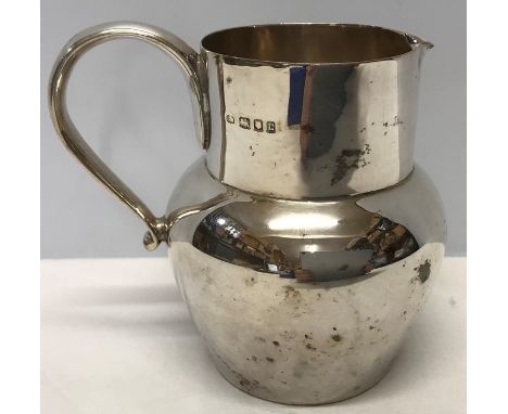 Hallmarked silver jug, 11cms tall, London 1918/19 approx 242gms. 