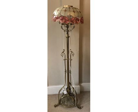 A good quality early 20thC brass standard lamp and shade. 