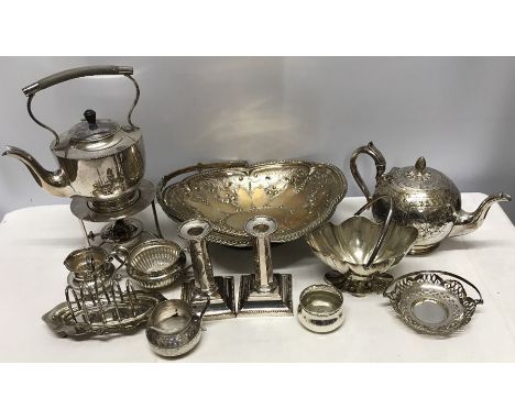 Selection of silver plated wares, spirit kettle, teapot, toastrack, candlesticks, baskets etc. 