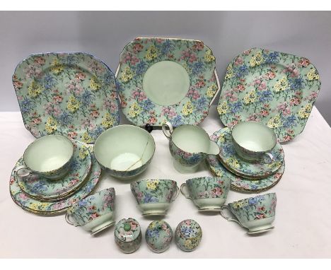 A part Melody pattern Shelley tea service, damage to sugar bowl, mustard pot and one cup and saucer. 5 plates, 3 large plates