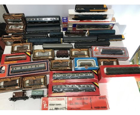 A large quantity of trains, carriages including Hornby Intercity, Fleischmann, Palitoy mainline railways Jouef many boxed. 
