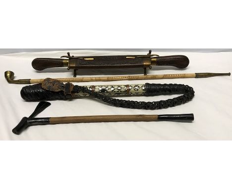 Wooden cased carving set, camel whip with mother of pearl inlay, small wooden axe and a long cane shaft pipe.
